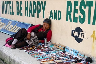 SIESTA TIME: An old woman dozes beside the jewelry she has laid out on the streets in Lakeside, Pokhara on Monday afternoon.