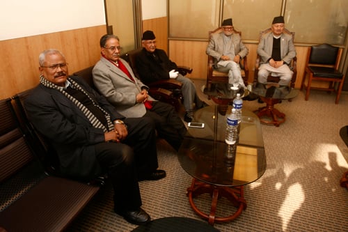 Leaders from Nepali Congress, CPN-UML, UCPN (Maoist) and Madhes based parties sit for a meeting with CA Chair Subas Nembang at the Constituent Assembly Building in Baneshwor on Tuesday.