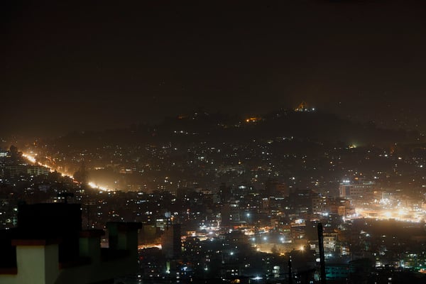Swayambhunath Stupa perched on the hill (right) and Kalanki as seen from Kirtipur on Monday night.