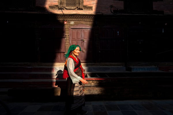A woman walks around Basantapur Darbar Square on Monday. Heritage sites within Kathmandu Valley were reopened today.