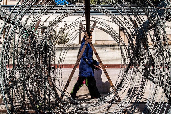 Police lay down concertina wire in New Baneshwor, as student unions gathered outside the Everest Hotel for political discussions on Friday.