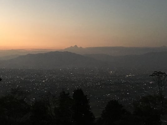 Kathmandu Valley lit up for Laxmi Puja Thursday evening as the sun sets behind Mt Himalchuli on the horizon.