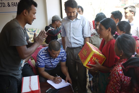Members of Master, Alantic Sport Pte. Ltd handing over relief aid to residents of Siddhipur at Lalitpur on Monday.