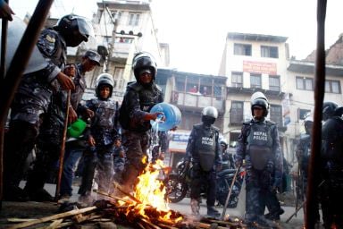 ETERNAL FLAME: Police try to put out fire started by members of Nepal Student Union (NSU) during a protest against PM Baburam Bhattarai at Bagbajar on on Sunday.