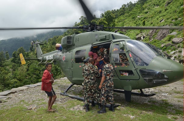 Nepal Army helicopter rescues landslide victims in Ri village, Dhading on Sunday. Monsoon-induced landslides are threatening villages affected by last year's earthquake.