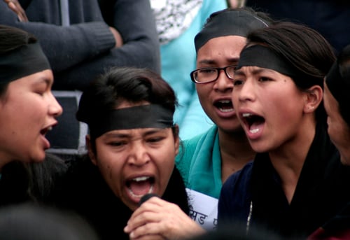 Girls participating in a sit-in staged by women rights activists on Wednesday in Kathmandu demand justice for acid attack victims.