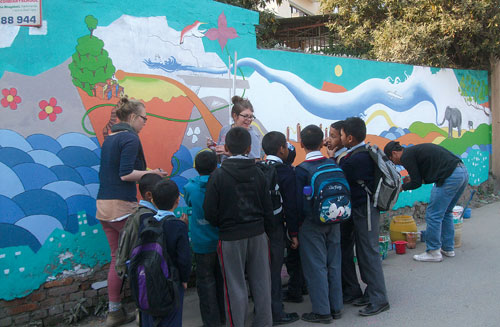 SHOWING OFF: School children admire a street mural depicting the Tarai at Swayambhu and ask questions to volunteer artists from Satya Media on Monday.