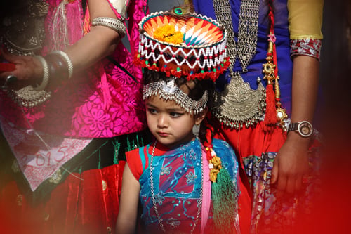 A girl takes a part in a rally prior to the inauguration ceremony of the Maghi festival at Tundikhel on Thursday.