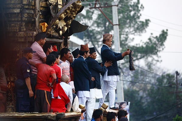 Guthi Sansthan official displays the bejeweled vest known as bhoto to the public from the chariot of Rato Machhendranath during the Bhoto Jatra festival in Jawalakhel on Thursday.