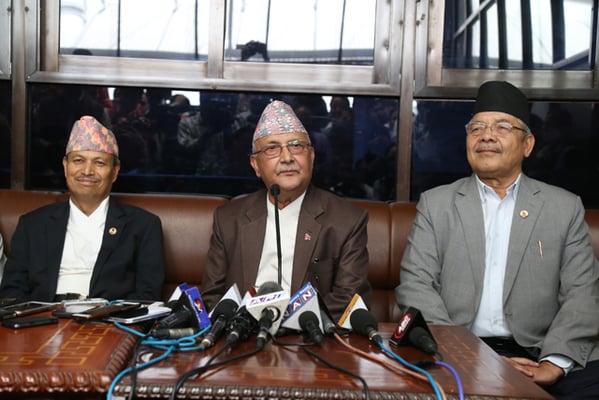 CPN-UML Chairperson KP Oli talks to the media after his return from a medical trip to Thailand at Tribhuvan International Airport on Monday.