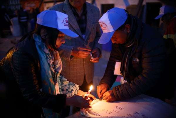 Election commission officials seal the ballot box at the end of the final phase of parliamentary and provincial elections in Kathmandu Darbar Square on Thursday.