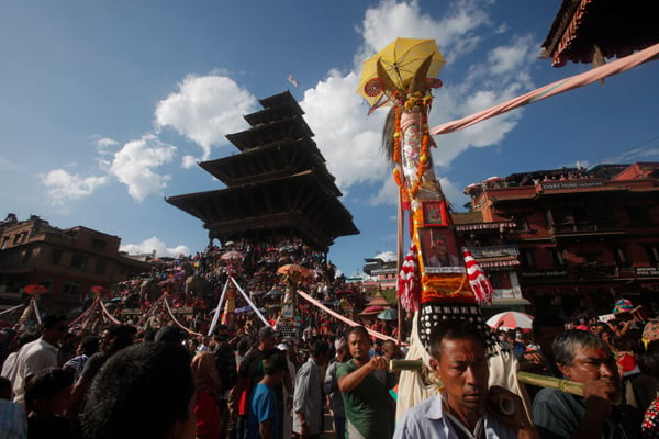 People observe Gai Jatra, a festival of death and rebirth, in Bhaktapur on Sunday. Also known as Saparu, Gai Jatra carried special significance this year because the earthquake caused almost 2,000 fatalities in Kathmandu Valley. Of the 8,844 people killed, 20 per cent were Newars.