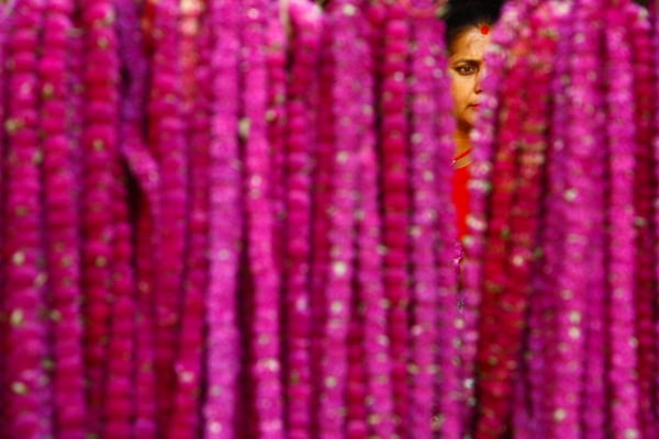 35-year-old Geeta Karki sells 'Makhmalis' for the upcoming Tihar festival in Ason on Thursday. Working as a vegetable vendor for the past four years, she sells flowers only during Tihar.