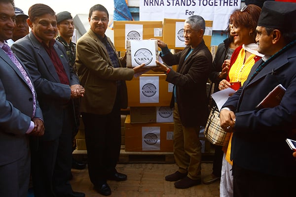 President of NRNA (Non-Resident Nepali Association) Shesh Ghale hands over medicine worth Rs.3.8 Million to Minister for Health and Population Ram Janam Chaudhary at Department of Health Service in Teku on Tuesday.