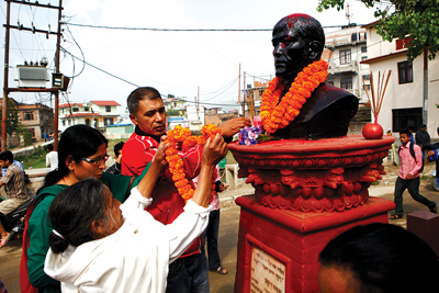 LOST IN THE REPUBLIC: The family of Pradhyumna Khadka, who died during the 2006 Jana Andolan, put garlands around his statue in Kalanki to commemorate Republic Day on Wednesday morning.