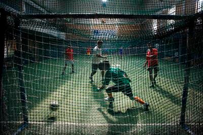 GOAL!: Players enjoy a futsal match in GAA hall at Thamel on Tuesday.