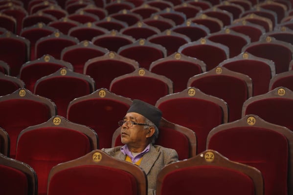 Rohit Kumar Hingmang, 63 a Maoist cadre from Kathmandu-31 waits for the program to begin at the City Hall. The left alliance organised the program to congratulate the winners of the provincial and parliamentary elections on Wednesday.
