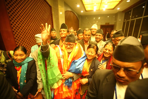 HERE I COME: Nepali Congress President Sushil Koirala is wrapped in scarves after being elected as Nepal's 37th prime minister at the CA hall on Monday.