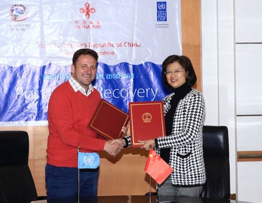Chinese Ambassador to Nepal Yu Hong and UNDP Nepal Country Director Renaud Meyer shake hands after partnering to provide post-flood recovery assistance worth USD four million on Thursday. The devastating monsoon floods and landslide killed dozens and affected 20 per cent of Nepal's population living in the eastern plains.