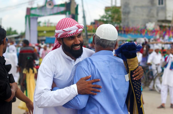 Two Muslims in Birganj exchange greetings on Eid al-Fitr on Monday. The festival marks the end of the Muslim fasting month of Ramadan.