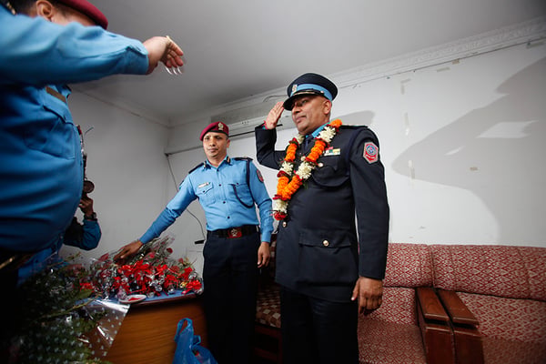 A police officer salutes the newly appointed Inspector General of Police Prakash Aryal in Singhadurbar on Monday.