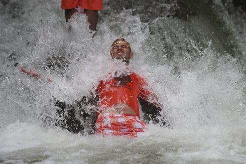 SPLASH: A Hindu devotee takes a holy bath at Bagmati river in Sundarijal on Monday. The month of Shrawan in the Hindu calendar is considered auspicious.
