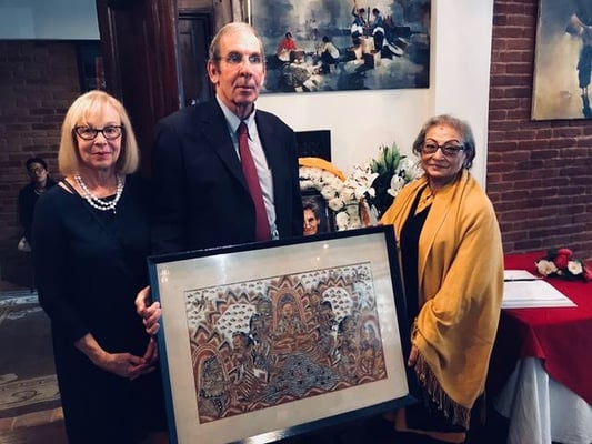 During a tribute to Elizabeth Hawley at Dwarika’s Hotel on Thursday, her nephew and his wife Michael and Meg Hawley Leonard present the hotel’s Ambica Shrestha with Liz Hawley’s Balinese painting.