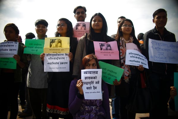 Youth activists take to the streets to protest against the impeachment of Chief Justice Sushila Karki at Maitighar mandala on Monday.
