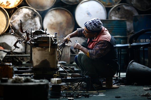 An electrician repairs a transformer at Nepal Electricity Authority's workshop at Lainchaur on Wednesday. More than 400 transformers have exploded in the city due to excessive power consumption since September.