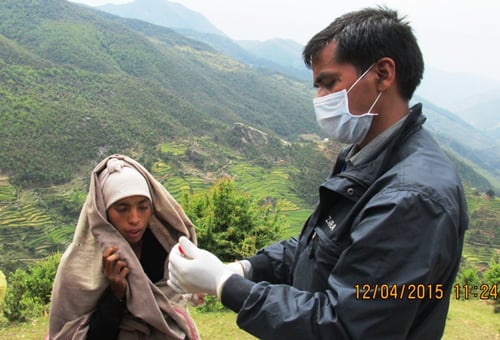 A health worker attends to a woman suffering from flu in Paink VDC of Jajarkot district last week.