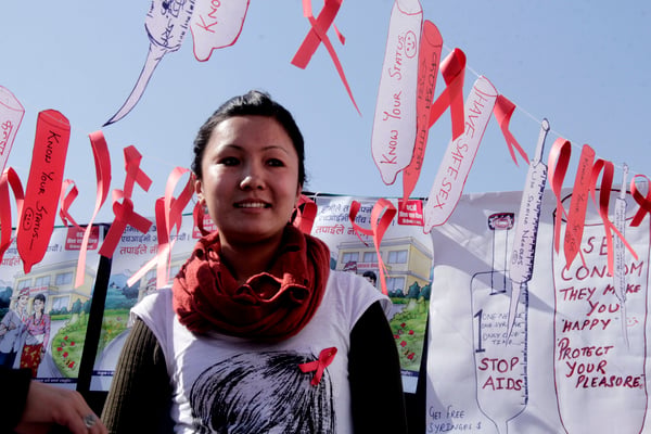STANDING TALL: A woman in a consultation centre promoting the reduction of the infection, discrimination and deaths caused by HIV/AIDs.
