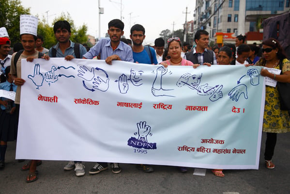 People attend a rally organised by the National Federation of the Deaf Nepal (NDFN) demanding national recognition to be given to sign language at Baber Mahal on Wednesday.