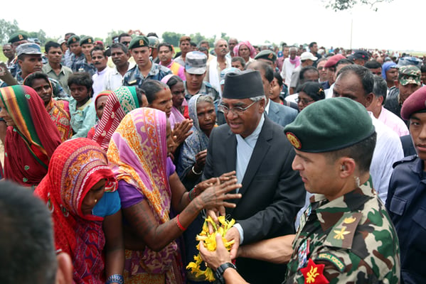 Prime Minister Sher Bahadur Deuba meets the locals in Bhediya, Saptari during his visit to survey the flood affected area on Friday.