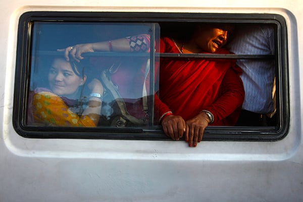 Passengers ride an overcrowded bus in Old Bus Park on Friday. There has been limited public transportation around the city as a result of the ongoing fuel crisis.