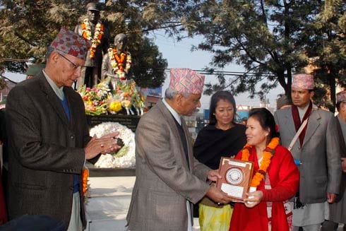 PEACE KEEPERS: Chari Maya Tamang receiving the Krishna Mohan Peace Award from Chairman of Interim Election Council Khil Raj Regmi on Sunday.
