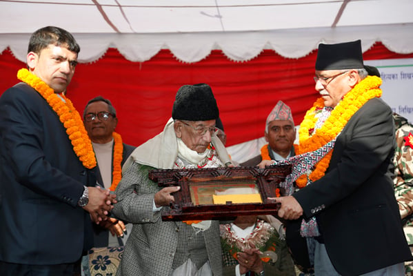 Prime Minister Pushpa Kamal Dahal honors litterateur Madan Mani Dixit at Sajha Samman ceremony organized by Sajha Prakashan in Pulchok on Wednesday.