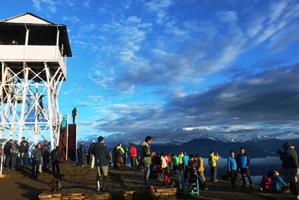 Tourists gather to watch the sunrise in Poonhill on Friday morning.