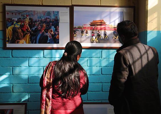 Visitors look at photographs during the second Pokhara Chinese Film Festival and 2017 China Story Photo Exhibition held by China Cultural Centre, Nepal in Pokhara on Saturday.