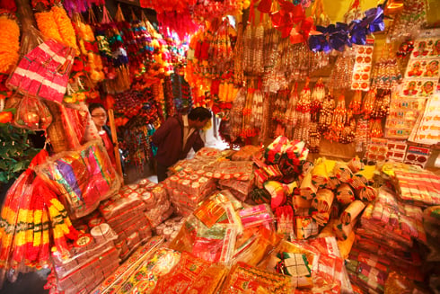TIHAR BLING: Customers browse through items on sale at a stall at Ason on Thursday.
