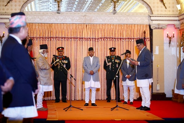 CROOKED HEAD: Acting chief justice Damodar Sharma (left) administers the oath of office to the new chief of CIAA Lok Man Karki (right) at Sital Niwas on Wednesday.