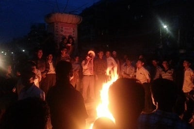 ON FIRE: Demonstrators gather in Banepa bazar on Saturday evening to protest against the government’s decision to hold elections.