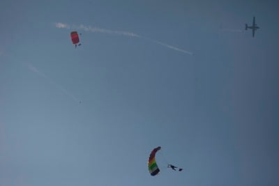 THE SKY IS THE LIMIT: Army soldiers paragliding during a parade marking Army Day in Kathmandu on Sunday.