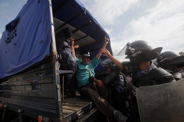 Police arrest a protester at Bijulibazar on the second day of the nationwide general strike on Monday.