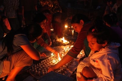 PEACEFUL MOMENT: Devotees light candles in front of Machindra Nath at Lagankhel on Sunday evening.