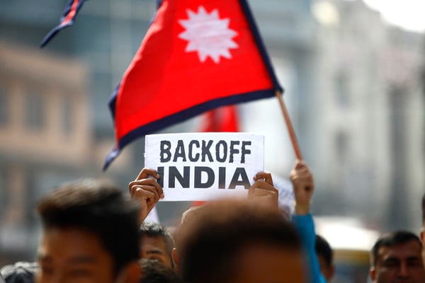 As India imposes an unofficial blockade against Nepal to put pressure on Nepali political parties to amend the new constitution, youth activists carry out a rally against Indian interference in Kathmandu on Saturday.