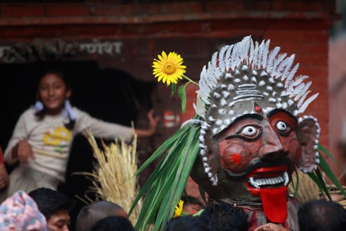 DEFEATING EVIL: A girl looks on during the celebration of Ghanta Karna in Bhaktapur on Monday. The festival celebrates defeat of the mythical demon Ghanta-karna (bell-ears).