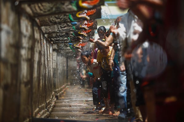 Devotees take a holy bath at the Balaju Bais Dhara during the Lhuti Punhi festival in Kathmandu on Friday.