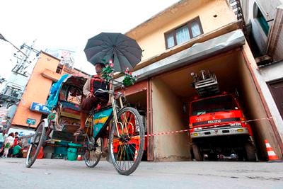 STAND BY: A rickshaw driver waits for customers in front of Juddha Fire Brigade at New road on Tuesday.