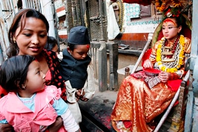 SPECIAL SUNDAY: Kumari the living goddess gives Tika to believers during the last day of Lalitpur Festival in Lalitpur on Sunday.
